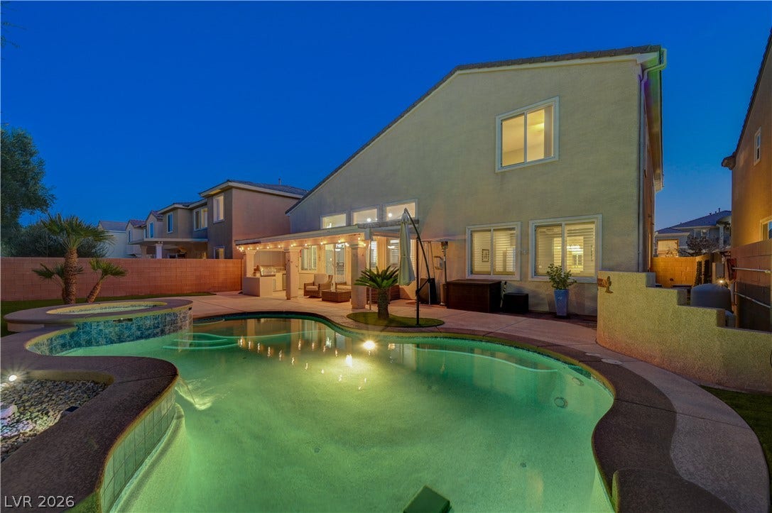 4120 Hawks Glide Avenue, North Las Vegas, NV 89084 A sparkling swimming pool serves as the center point of this inviting backyard oasis.
