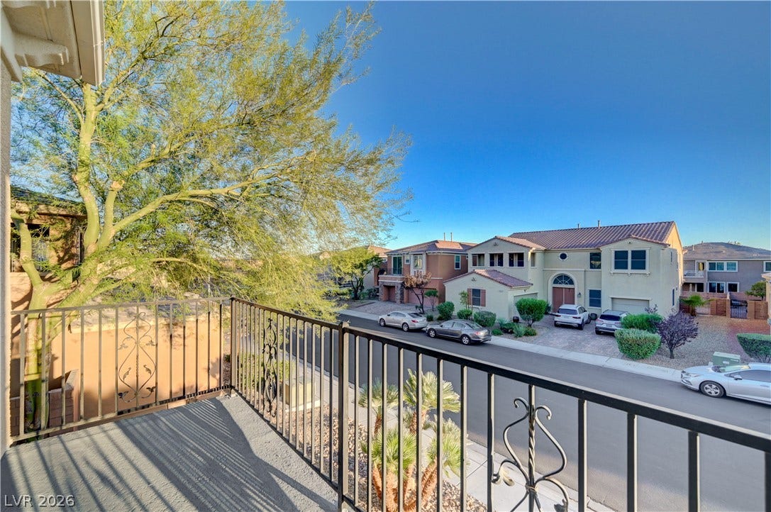 4120 Hawks Glide Avenue, North Las Vegas, NV 89084 A private balcony offers elevated neighborhood views and iron railings.