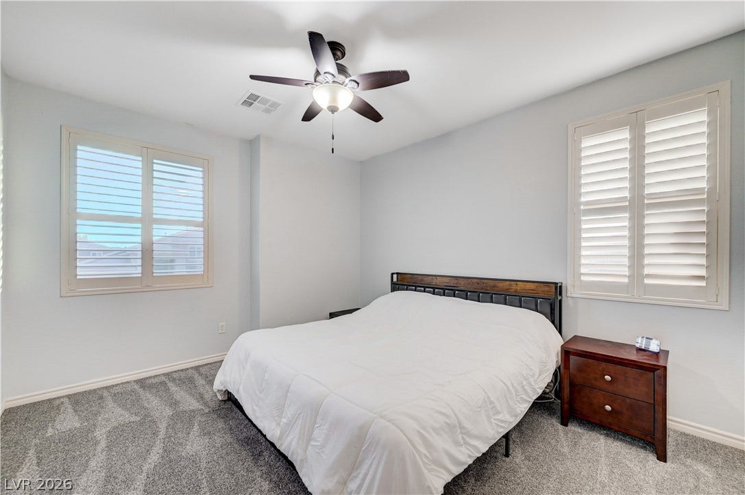 4120 Hawks Glide Avenue, North Las Vegas, NV 89084 Plentiful natural light streams through plantation shutters onto comfortable carpet flooring.
