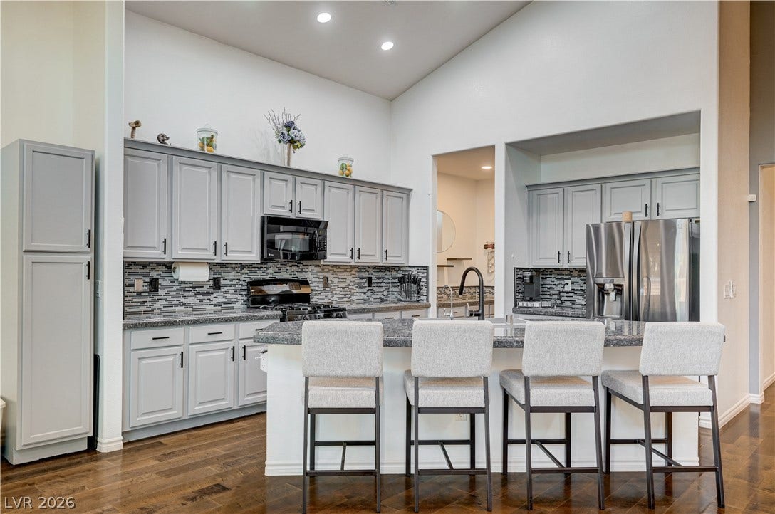 4120 Hawks Glide Avenue, North Las Vegas, NV 89084 Hardwood floors and vaulted ceilings frame this kitchen with a spacious breakfast bar.