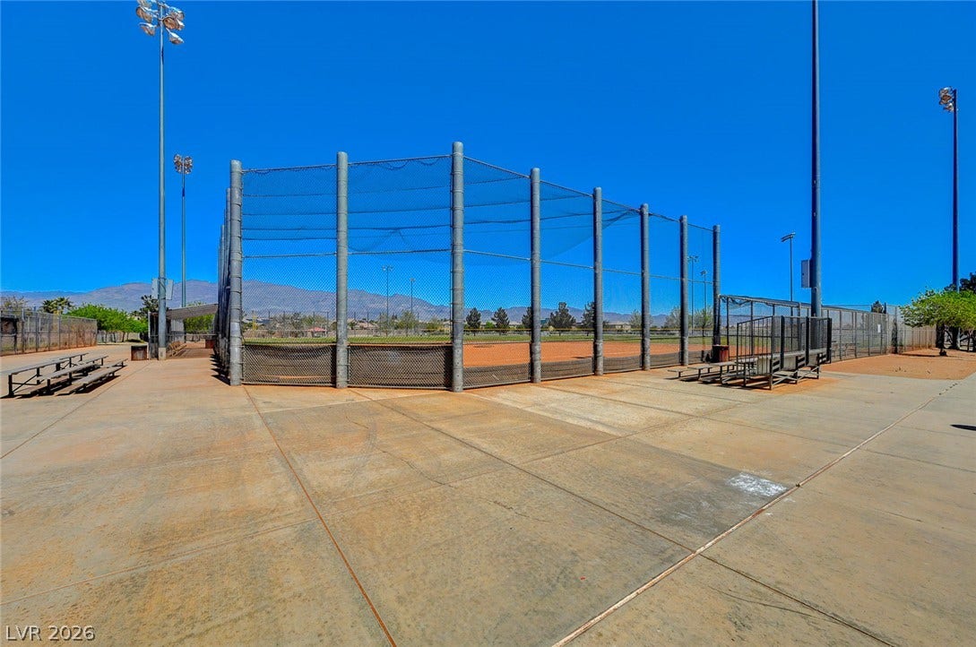 4120 Hawks Glide Avenue, North Las Vegas, NV 89084 A well-maintained community sports park under clear blue skies features a fenced ball field.