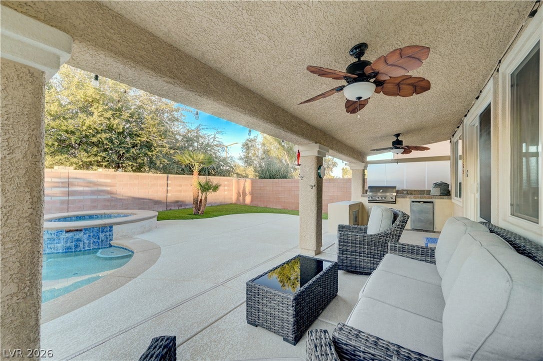 4120 Hawks Glide Avenue, North Las Vegas, NV 89084 An inviting covered patio features smooth concrete flooring and overlooks a private pool and spa.