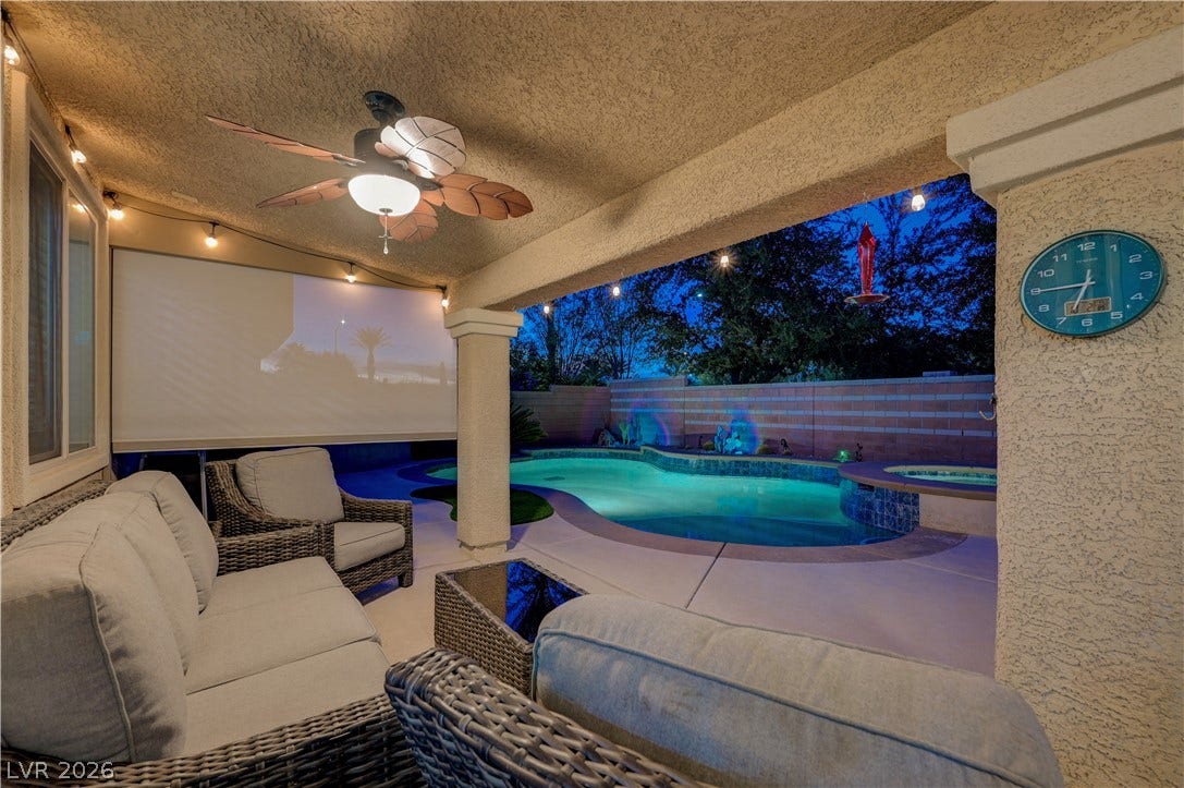 4120 Hawks Glide Avenue, North Las Vegas, NV 89084 A covered patio overlooks a private pool area ideal for evening relaxation and outdoor living.