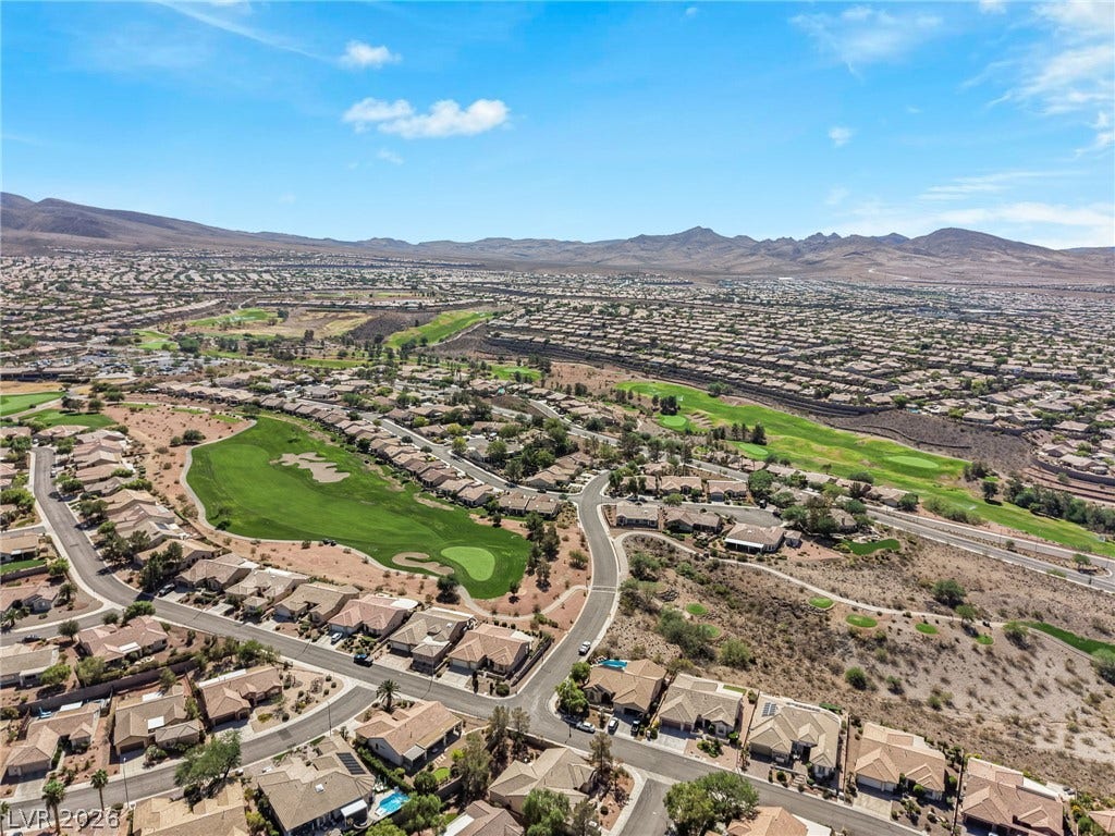 2738 Grand Forks Road, Henderson, NV 89052 An expansive valley setting highlights the surrounding golf course and distant mountain ranges.