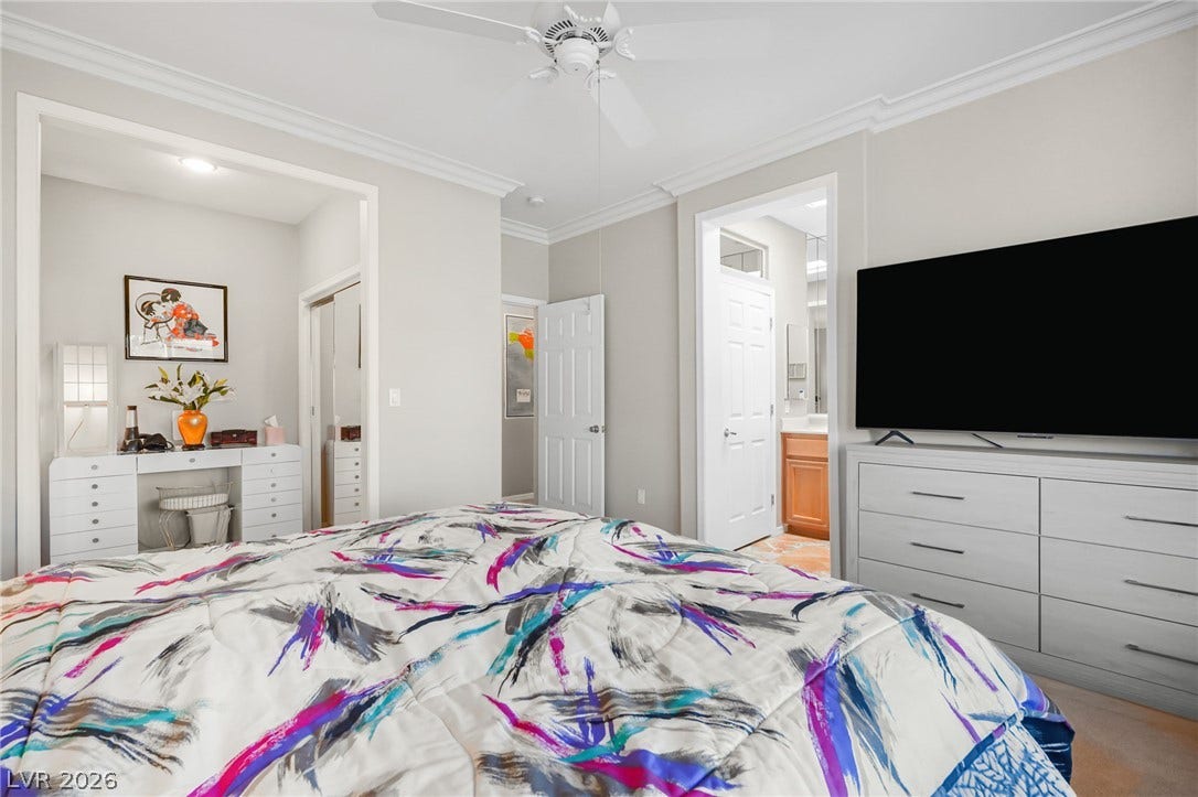 2738 Grand Forks Road, Henderson, NV 89052 Crisp crown molding and classic details elevate this comfortable primary suite.