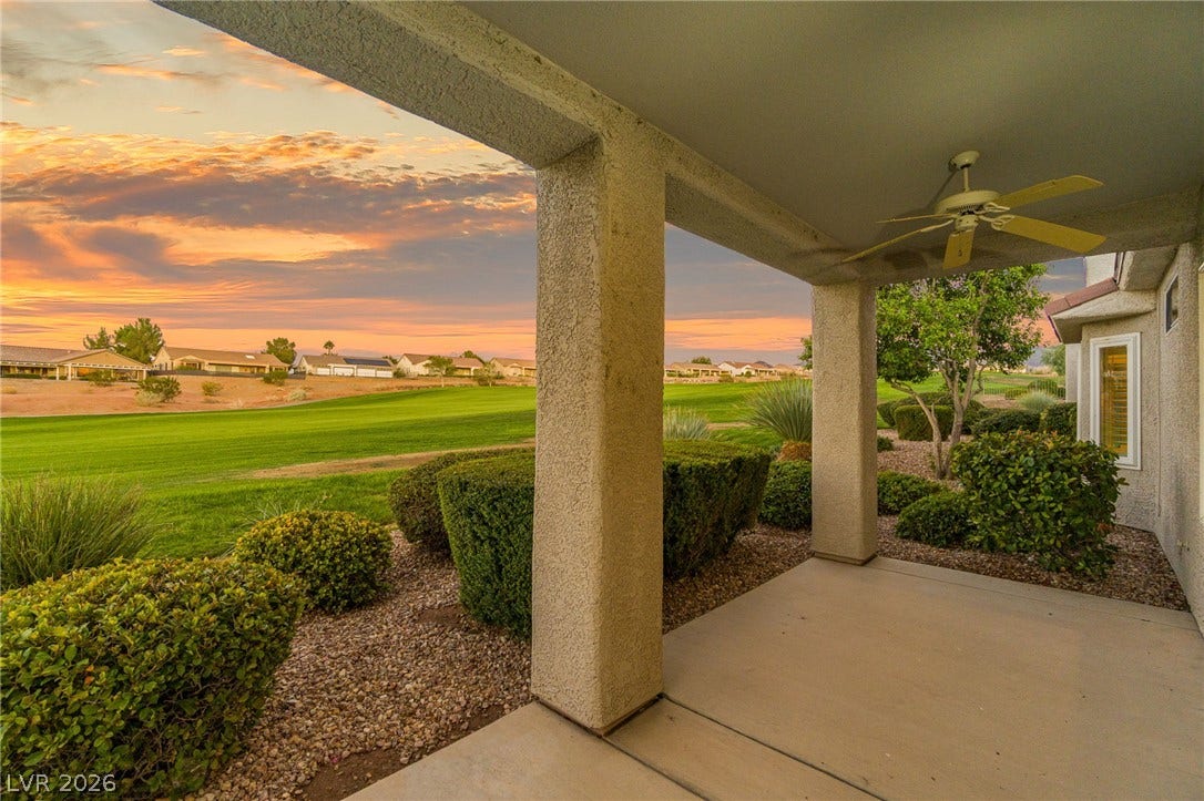 2738 Grand Forks Road, Henderson, NV 89052 Sweeping golf course views stretch beyond this covered back porch at sunset.