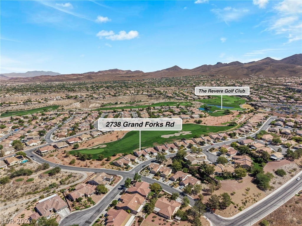2738 Grand Forks Road, Henderson, NV 89052 An elevated perspective showcases the surrounding neighborhood nestled along a lush golf course.