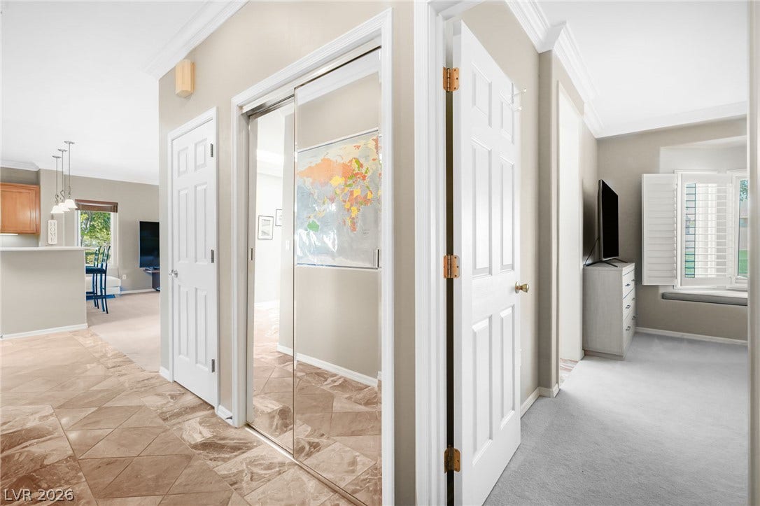 2738 Grand Forks Road, Henderson, NV 89052 Tiled entryways transition smoothly into carpeted living areas framed by elegant crown molding.