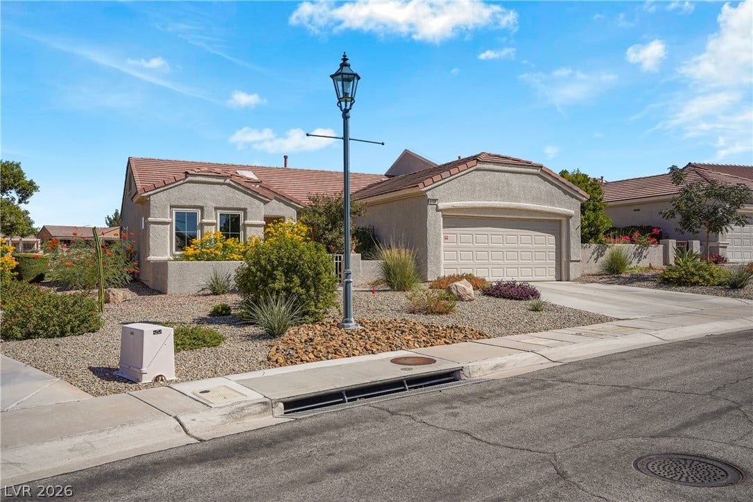 2738 Grand Forks Road, Henderson, NV 89052 Desert landscaping and a tiled roof enhance the curb appeal of this one-story residence.