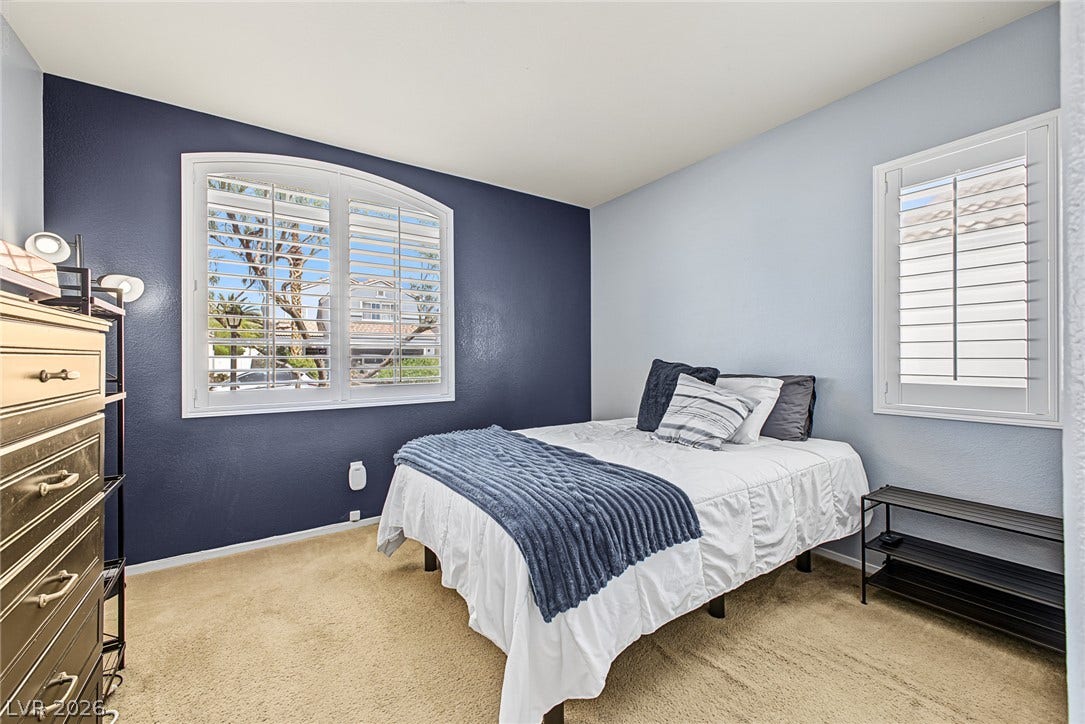 629 Lava Beds Way, North Las Vegas, NV 89084 Plentiful natural light streams through plantation shutters onto comfortable carpet flooring.