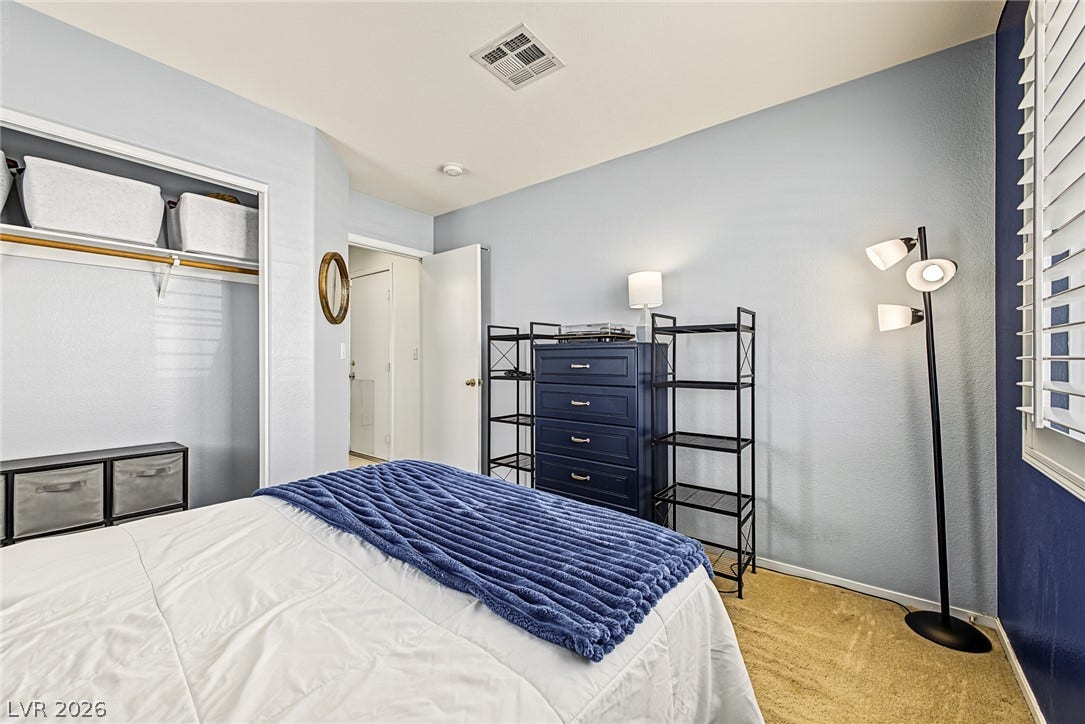 629 Lava Beds Way, North Las Vegas, NV 89084 Plush carpeting and plantation shutters highlight this cozy bedroom space.