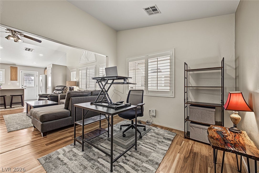629 Lava Beds Way, North Las Vegas, NV 89084 An open doorway connects this versatile home workspace directly to the main living areas.
