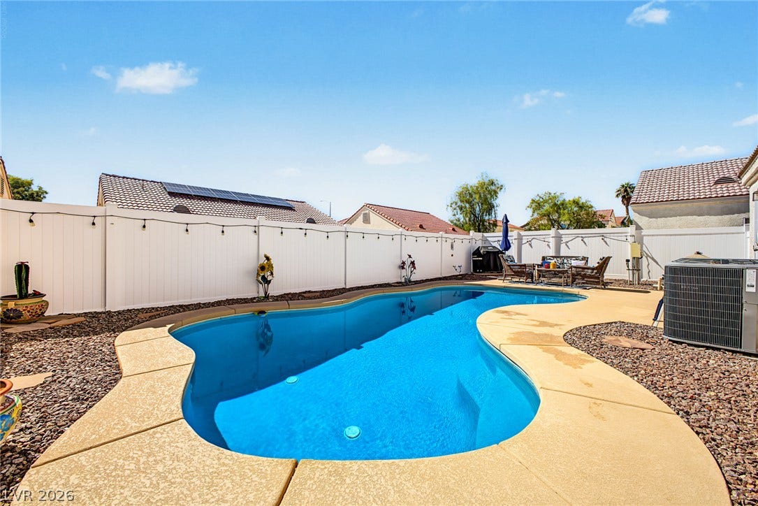 629 Lava Beds Way, North Las Vegas, NV 89084 A private swimming pool highlights this spacious backyard surrounded by secure fencing.