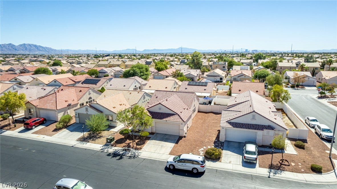 629 Lava Beds Way, North Las Vegas, NV 89084 Distant mountains frame this peaceful suburban neighborhood of classic tile-roofed residences.