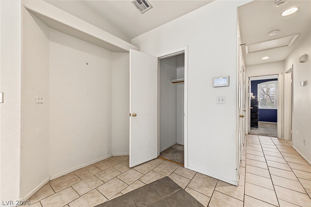 629 Lava Beds Way, North Las Vegas, NV 89084 Durable tile flooring runs throughout this functional hallway space complete with an integrated storage closet.