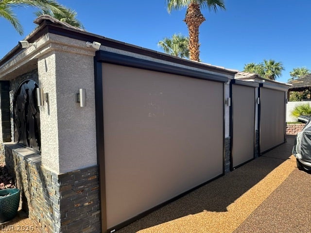 8175 Arville Street, #400, Las Vegas, NV 89139 Retractable outdoor shades protect this stone-accented structure from the desert sun.