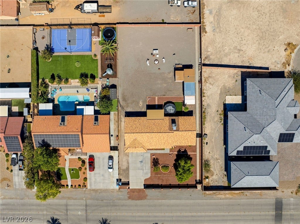 6560 Whispering Sands Drive, Las Vegas, NV 89131 An aerial perspective showcases the massive lot size and surrounding neighborhood landscape.