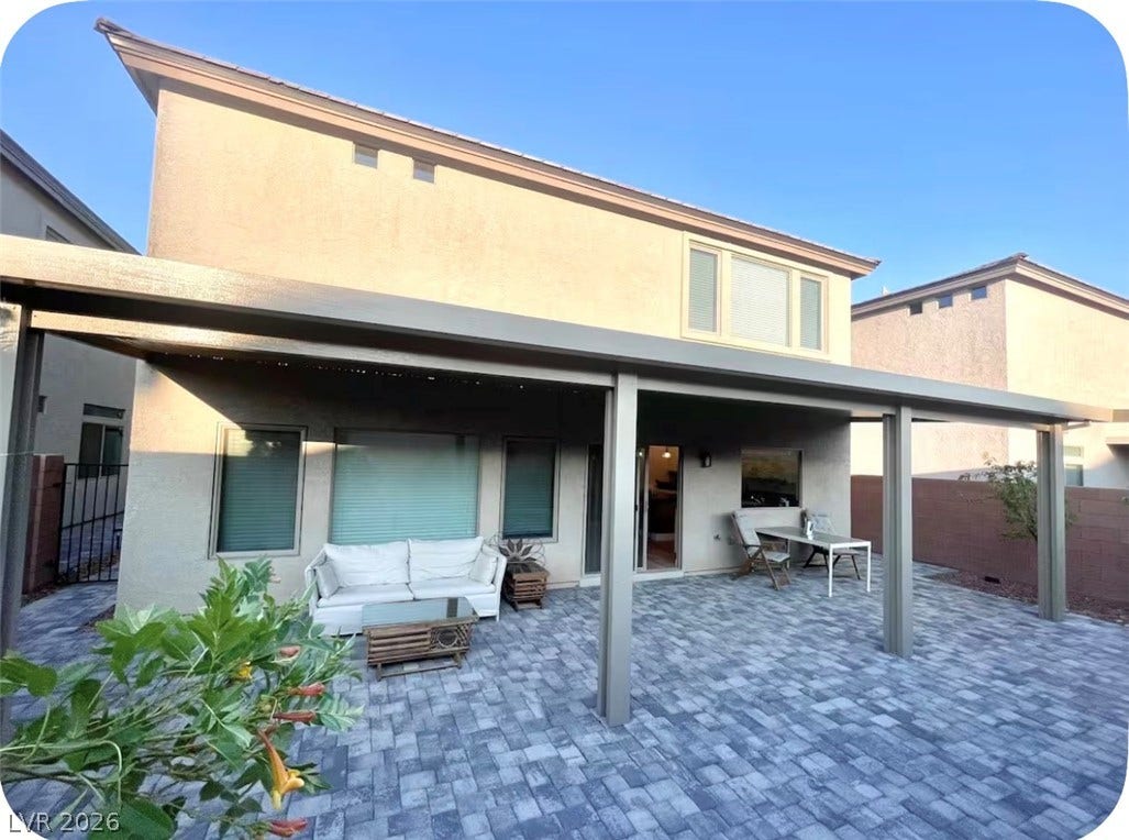 8683 S Black Cordon Road, Las Vegas, NV 89139 An expansive covered patio features clean modern paving and direct access to the main living areas.