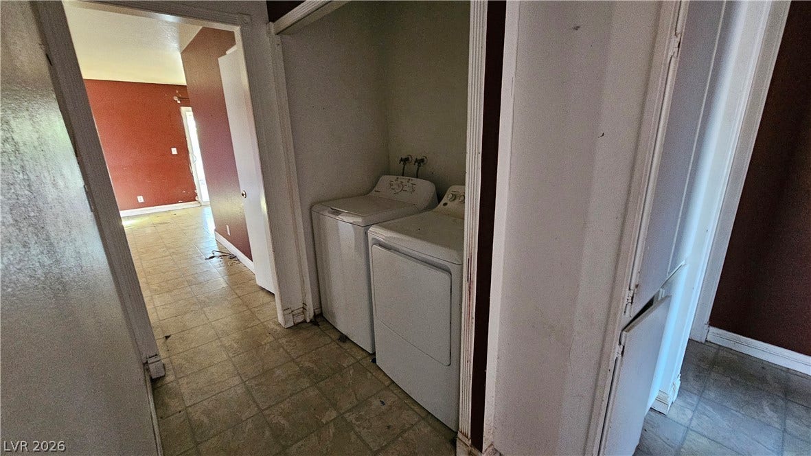 6777 Ledgewood Drive, Las Vegas, NV 89103 A dedicated laundry alcove sits conveniently off the main hallway with tiled flooring.