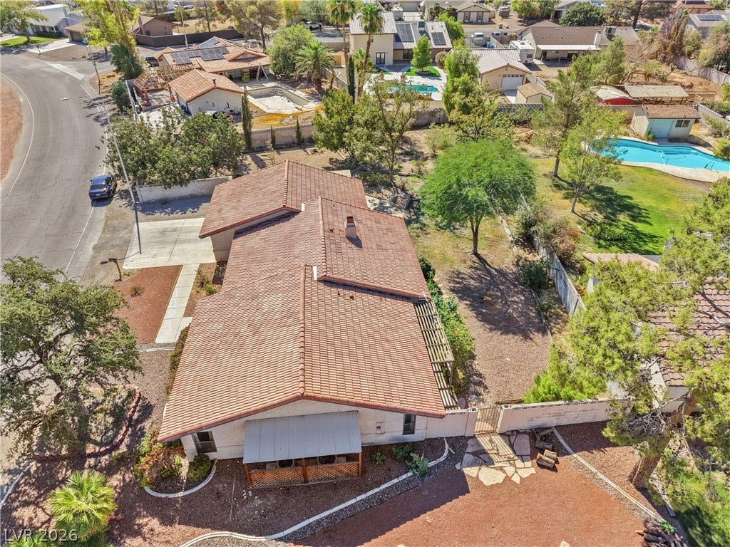 5601 Paseo Recallo Court, Las Vegas, NV 89108 An aerial perspective showcases the spacious lot size and classic tile roof design.