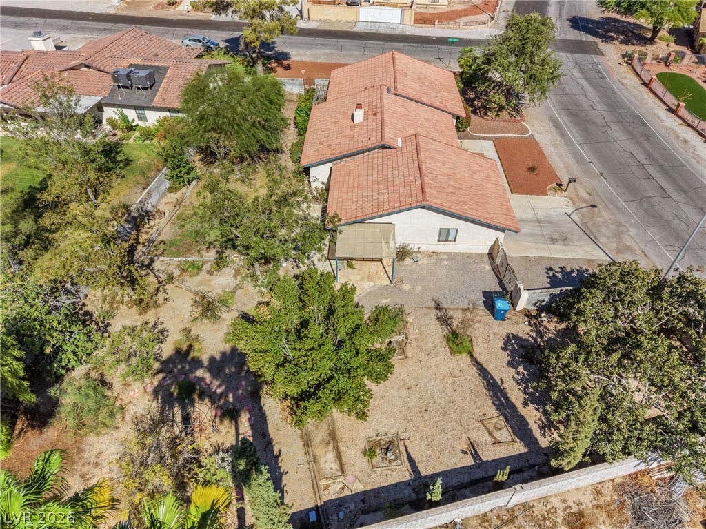 5601 Paseo Recallo Court, Las Vegas, NV 89108 An aerial perspective showcases the spacious yard and classic tile roof design.