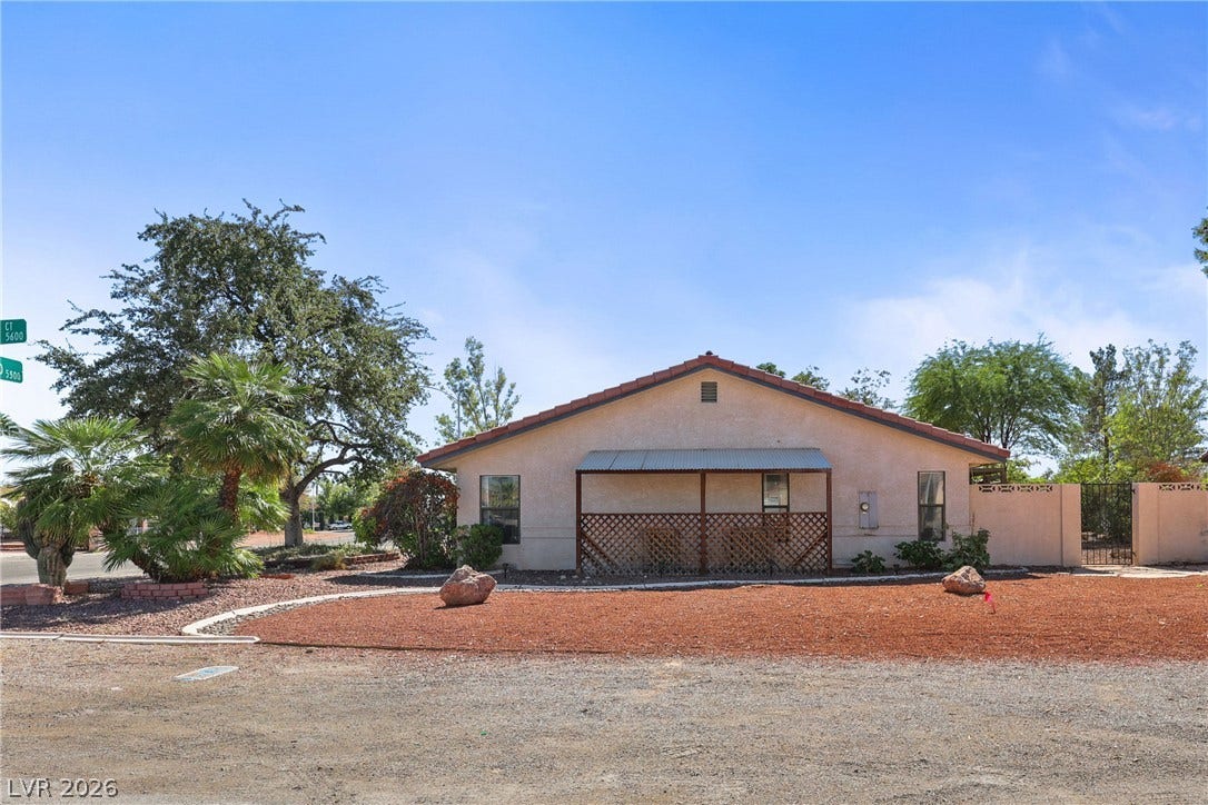 5601 Paseo Recallo Court, Las Vegas, NV 89108 Stucco exterior and low-maintenance desert landscaping define this classic single-story home.