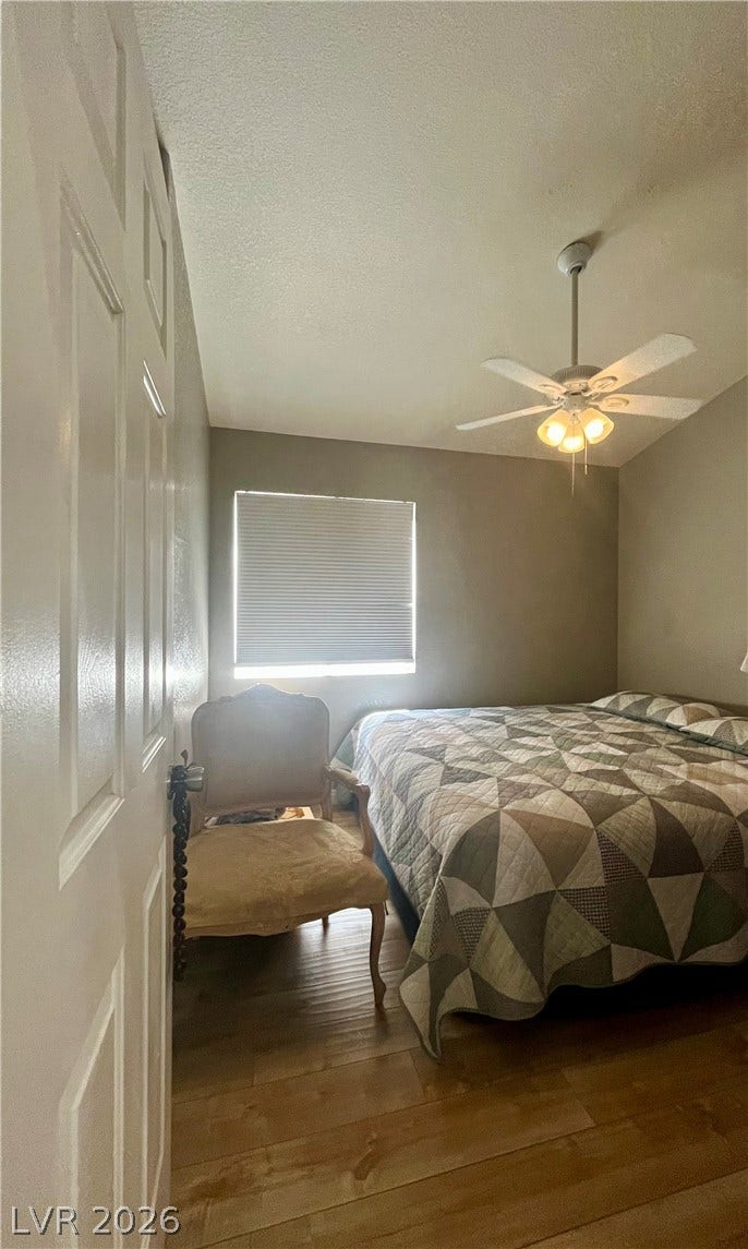 15 Rue des Champs, Henderson, NV 89074 Smooth wood floors and a classic window setup highlight this comfortable private retreat.