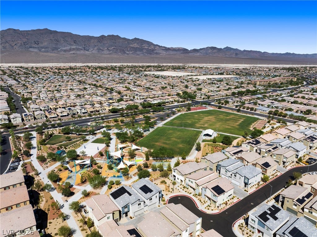 Panoramic mountain vistas frame this sprawling residential neighborhood centered around a community park.