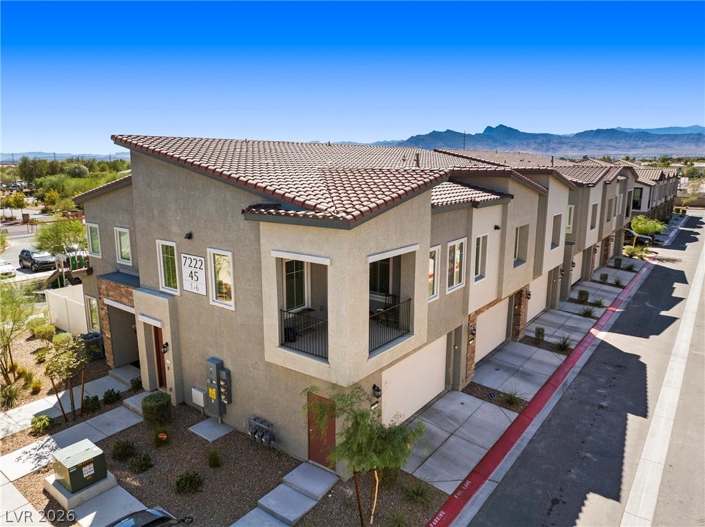 Spanish tile roofs and warm stucco exteriors stand beautifully against a mountain backdrop.