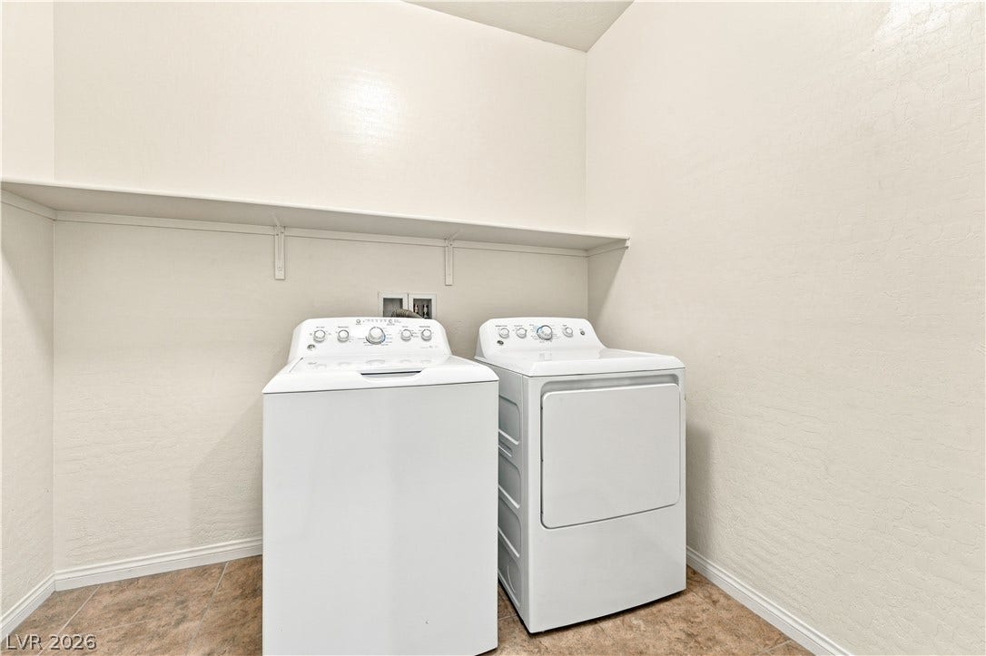 4209 Fairywren Drive, North Las Vegas, NV 89031 A dedicated laundry room features durable tile flooring and a convenient storage shelf. Plenty of room to add cabinetry or a sink.
