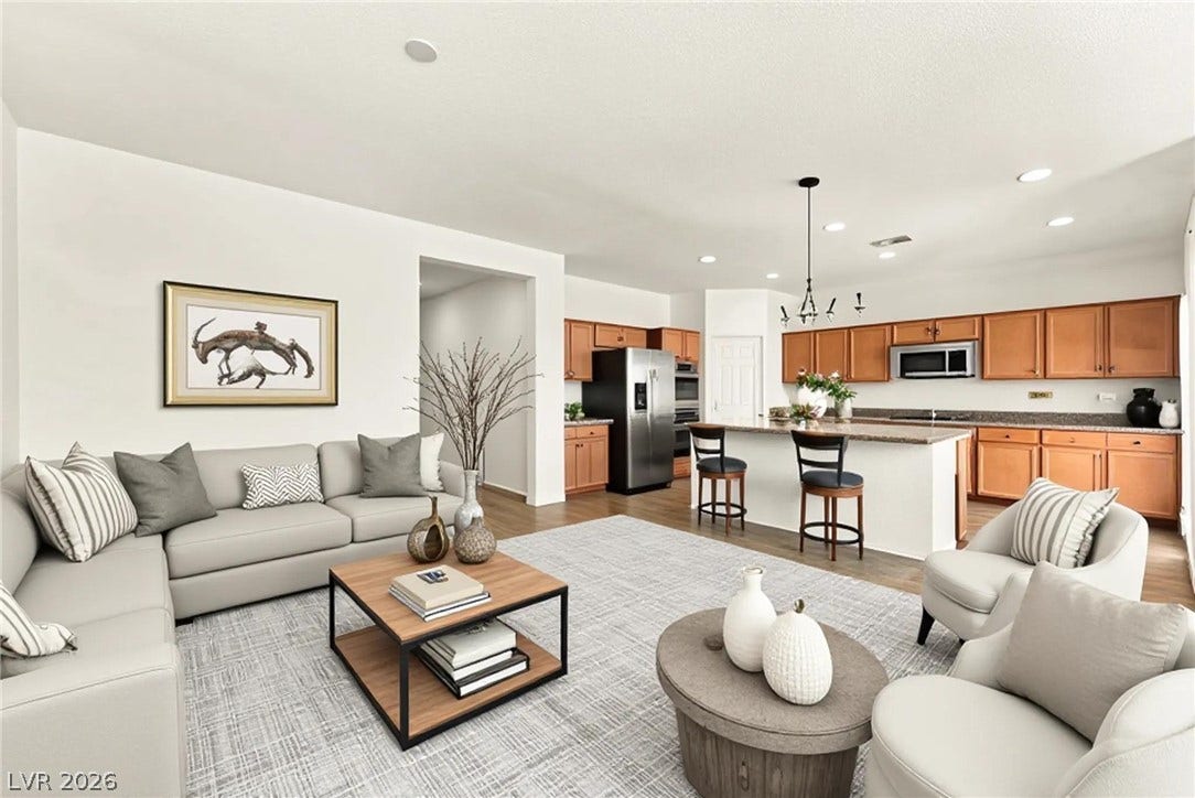 4209 Fairywren Drive, North Las Vegas, NV 89031 An open floor plan connects the comfortable living space directly to the kitchen area.