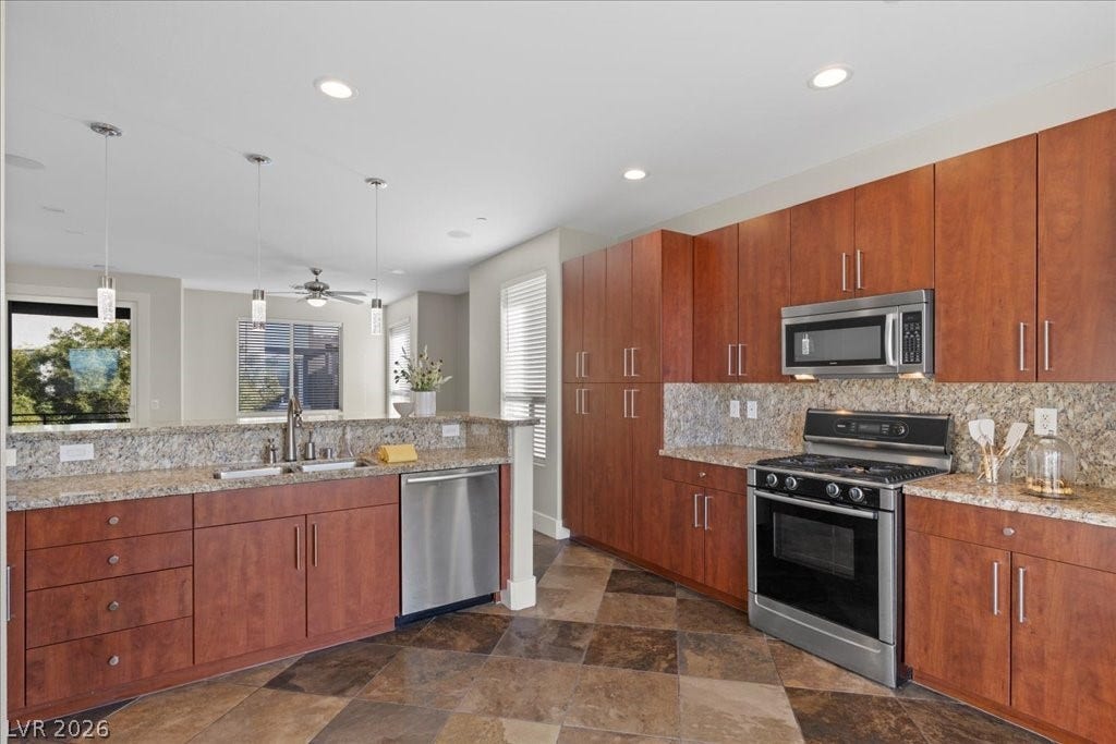 9050 W Tropicana Avenue, #1170, Las Vegas, NV 89147 Kitchen includes stainless steel appliances.