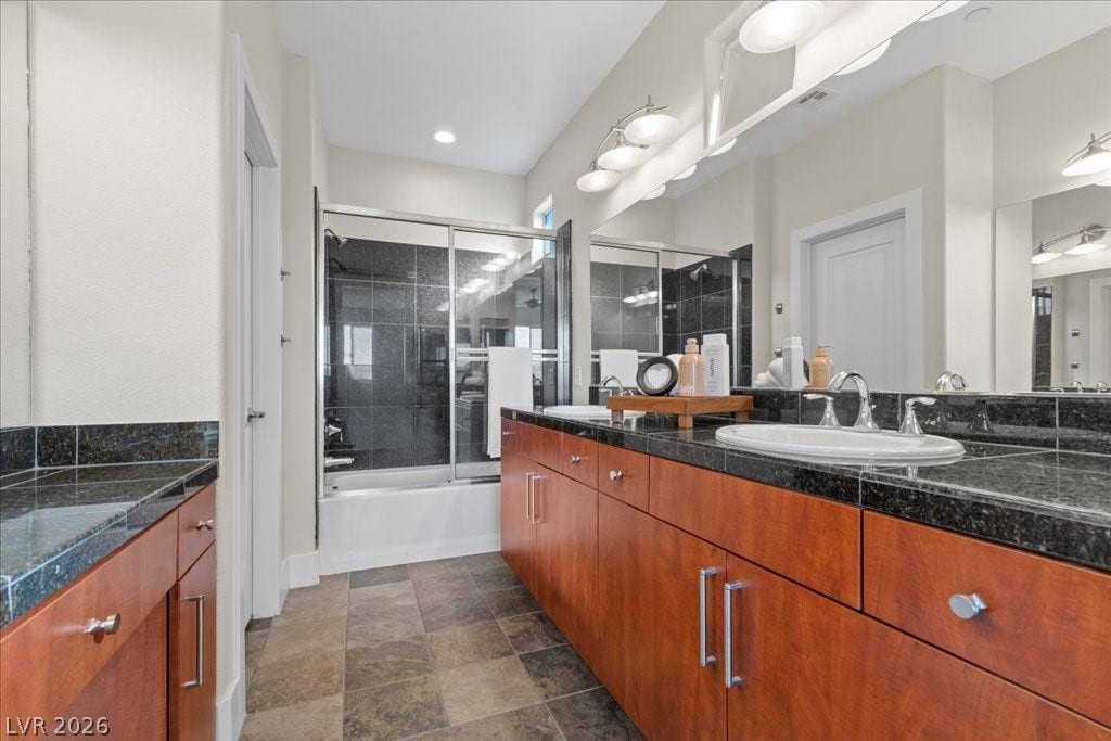 9050 W Tropicana Avenue, #1170, Las Vegas, NV 89147 Primary bathroom with dual sinks and granite sink surrounds.