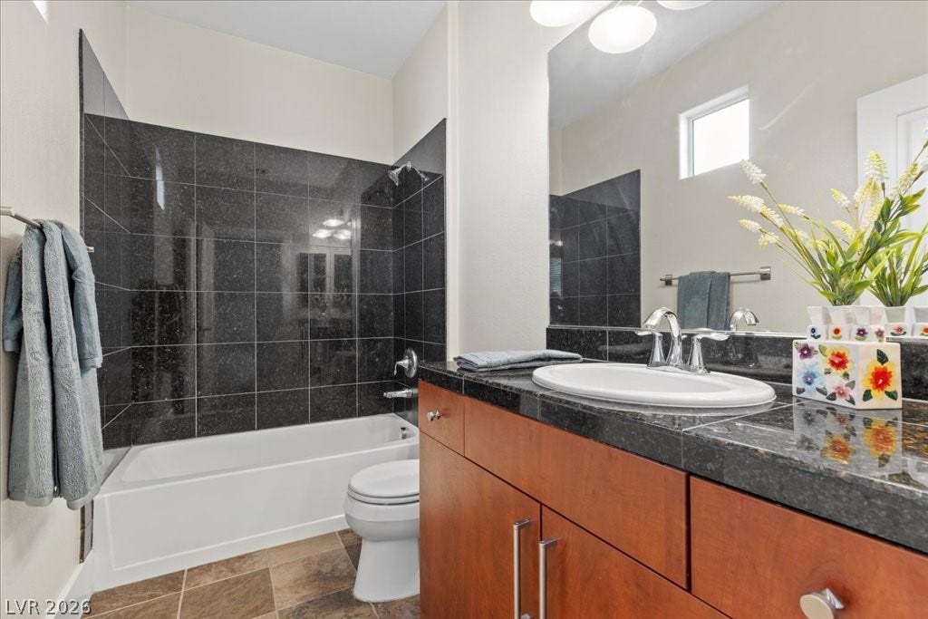 9050 W Tropicana Avenue, #1170, Las Vegas, NV 89147 Upstairs bathroom with tub/shower combo, granite sink surrounds.