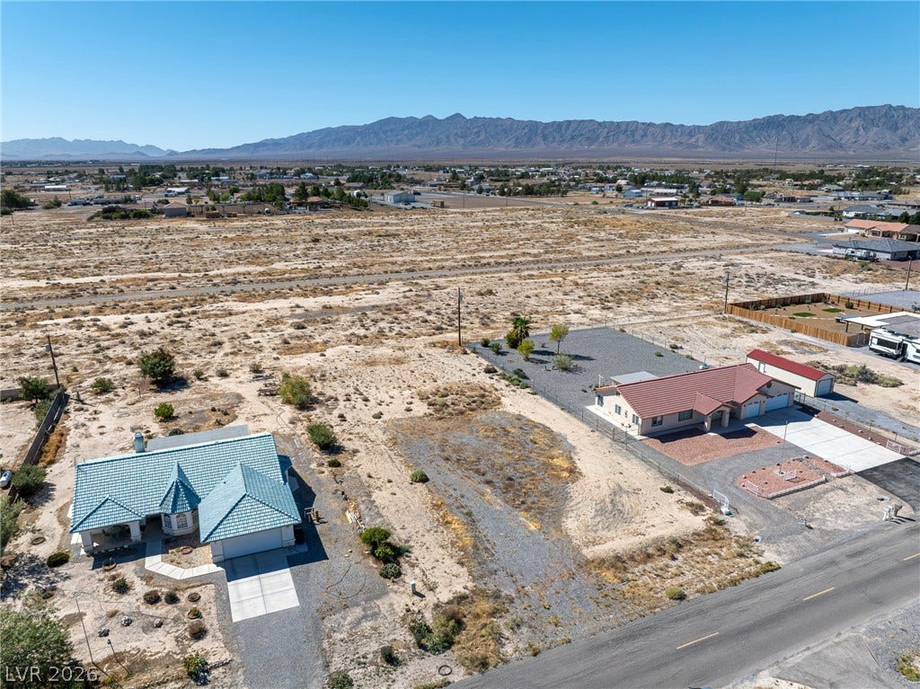 641 E Jaybird Street, Pahrump, NV 89048 Distant mountain ranges frame the expansive desert landscape surrounding these properties.