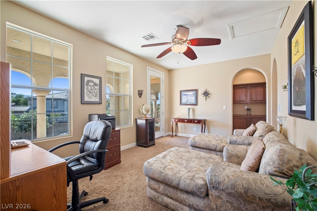 926 Loma Bonita Place, Las Vegas, NV 89138 Arched windows and doorways complement the built-in cabinetry and warm neutral walls.