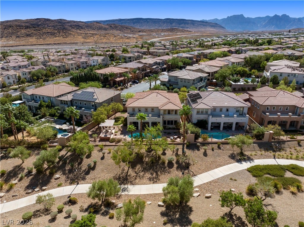 926 Loma Bonita Place, Las Vegas, NV 89138 A quiet pedestrian path winds past neighborhoods nestled against rugged mountain vistas.