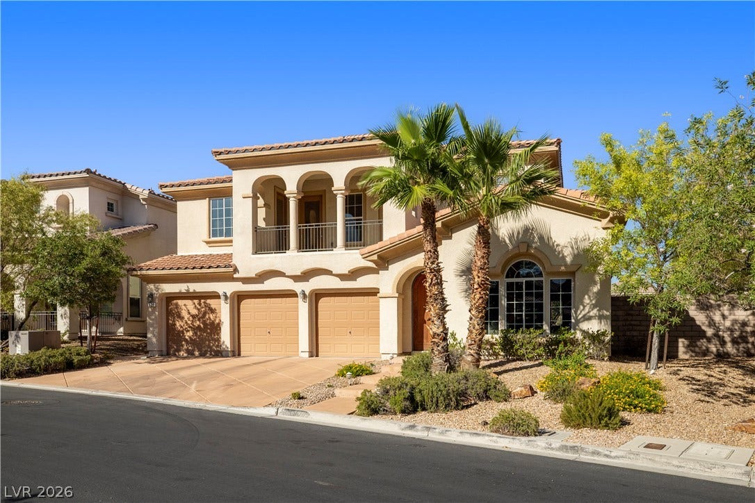 926 Loma Bonita Place, Las Vegas, NV 89138 Elegant Mediterranean styling defines this dual-level residence featuring a tile roof and arched balconies.