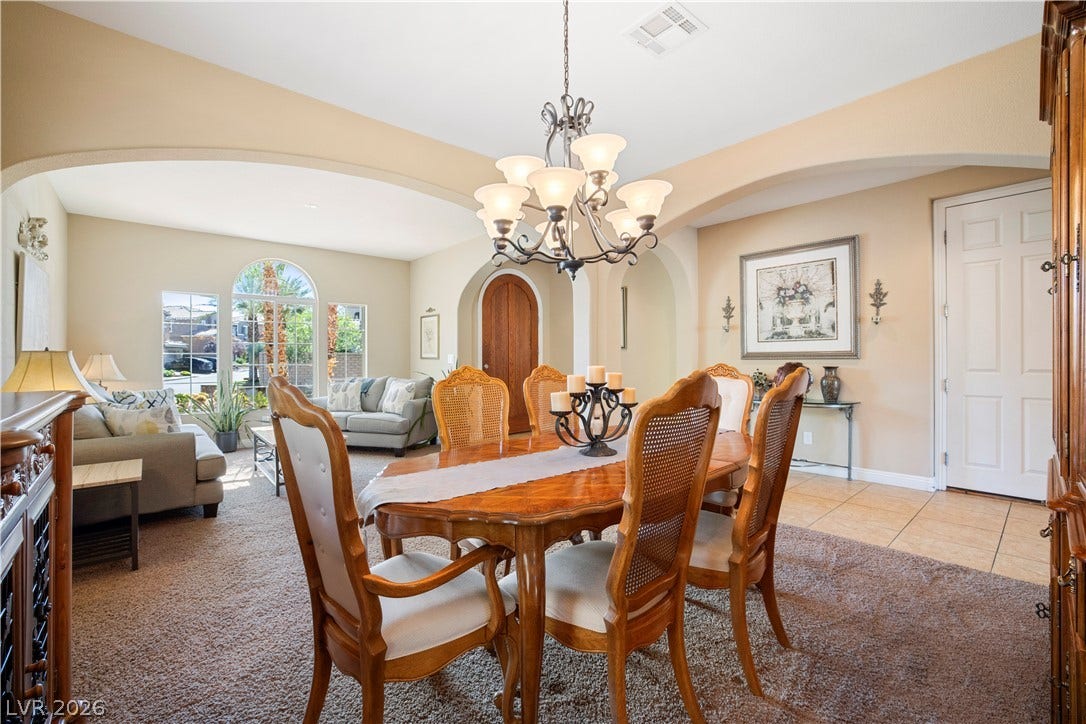 926 Loma Bonita Place, Las Vegas, NV 89138 Arched entryways and soft lighting enhance the transitions throughout this comfortable dining space.