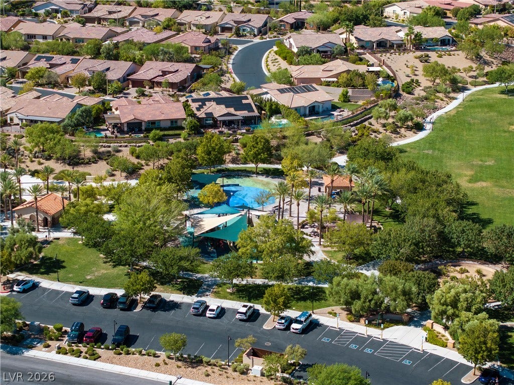 926 Loma Bonita Place, Las Vegas, NV 89138 A vibrant neighborhood park with shaded play areas borders the manicured lawns of this master-planned community.