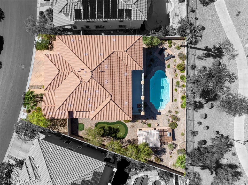 926 Loma Bonita Place, Las Vegas, NV 89138 An aerial perspective showcases the tiled roof, private swimming pool, and landscaped backyard design.