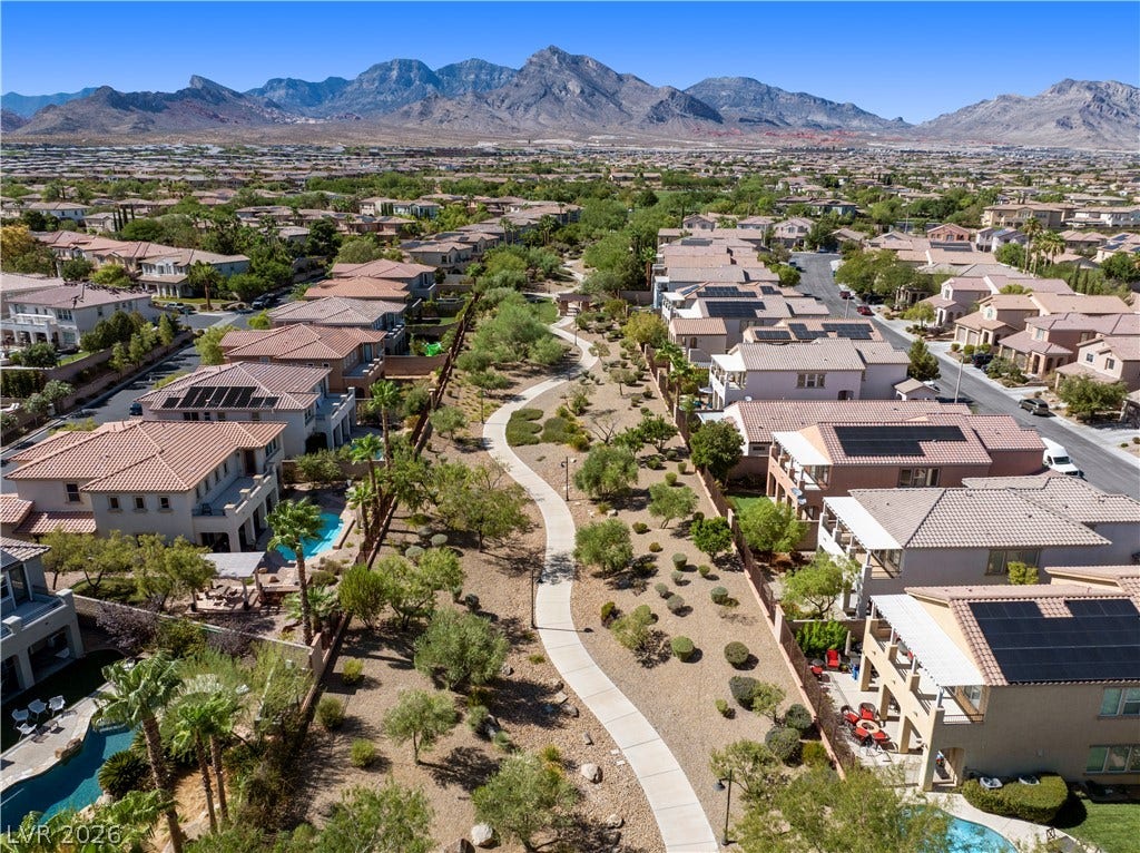 926 Loma Bonita Place, Las Vegas, NV 89138 Majestic mountain ridges provide a dramatic backdrop for this peaceful neighborhood walking path.