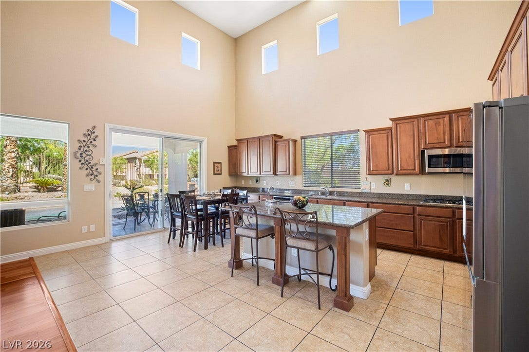 926 Loma Bonita Place, Las Vegas, NV 89138 High ceilings and tall clerestory windows bring abundant natural light into this spacious kitchen.