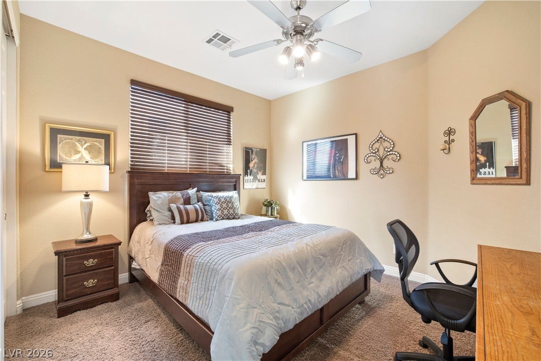 926 Loma Bonita Place, Las Vegas, NV 89138 High ceilings and soft carpeting create a cozy, inviting atmosphere in this bedroom.