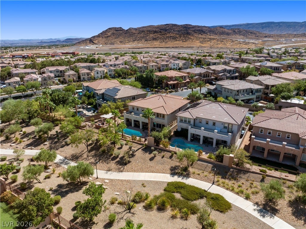 926 Loma Bonita Place, Las Vegas, NV 89138 Dramatic mountain vistas rise above this sprawling neighborhood featuring private backyard pools.