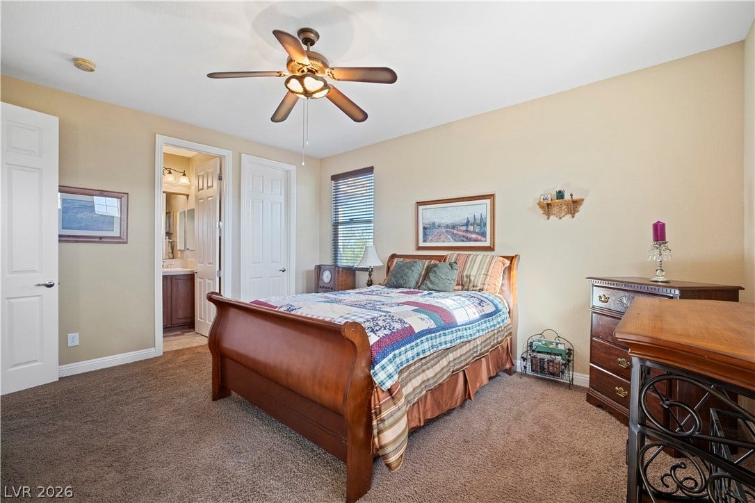 926 Loma Bonita Place, Las Vegas, NV 89138 Soft carpet and an attached bathroom create a comfortable, private suite.