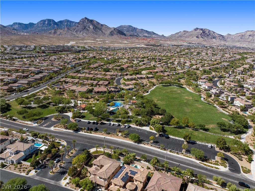 926 Loma Bonita Place, Las Vegas, NV 89138 Dramatic mountain backdrops frame a quiet neighborhood complete with a spacious central park.