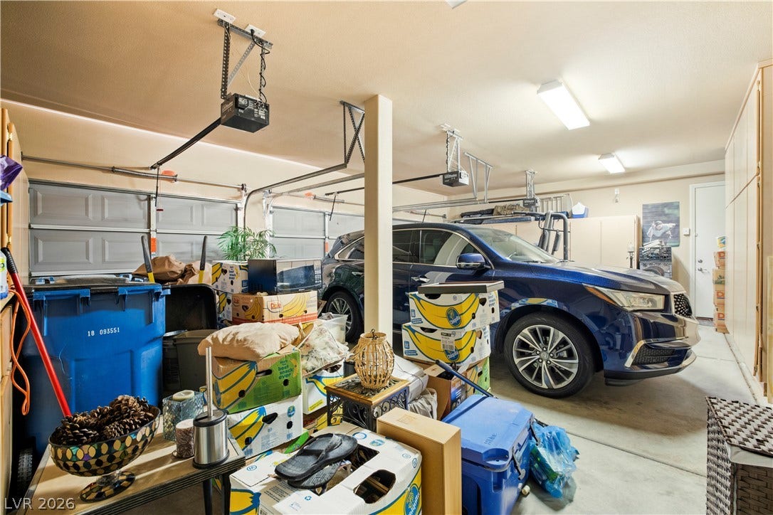 926 Loma Bonita Place, Las Vegas, NV 89138 An attached three-car garage provides extensive built-in storage cabinets and secure vehicle parking.
