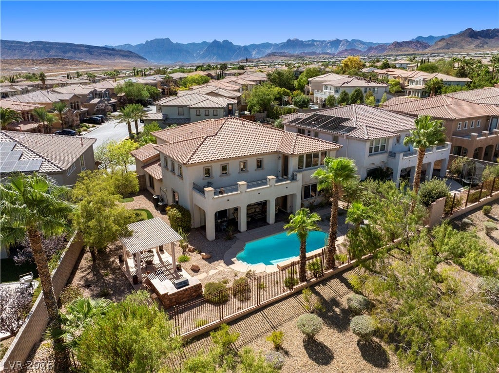 926 Loma Bonita Place, Las Vegas, NV 89138 Dramatic mountain vistas frame this desert property complete with a private pool and pergola.