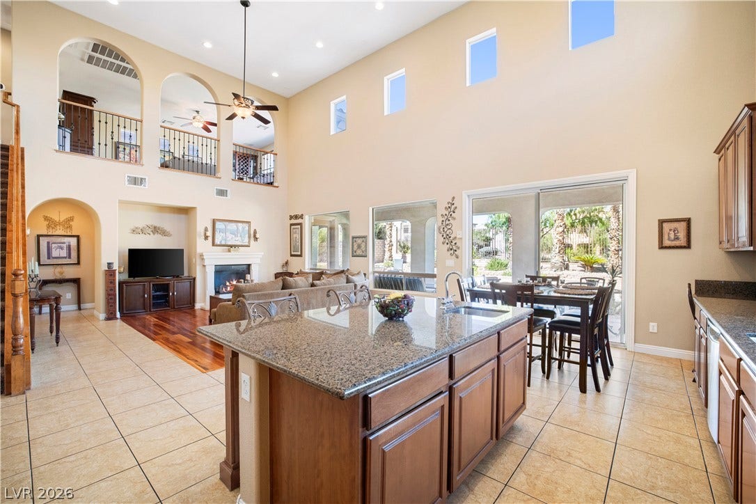 926 Loma Bonita Place, Las Vegas, NV 89138 Towering ceilings and arched overlooks define this open-concept culinary space.